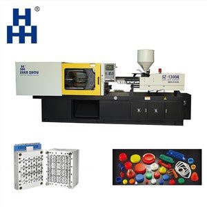 Stroj za brizganje s pokrovčkom na vrhu